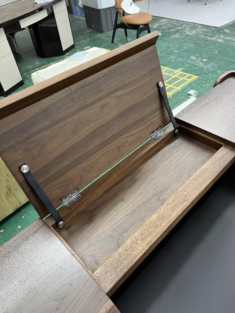 Walnut desk inspected at the factory before shipment