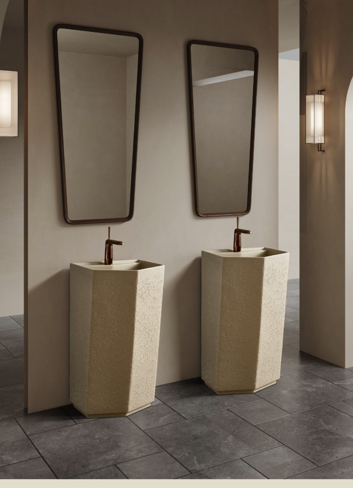 Two stone pedestal basins with copper taps and mirrors