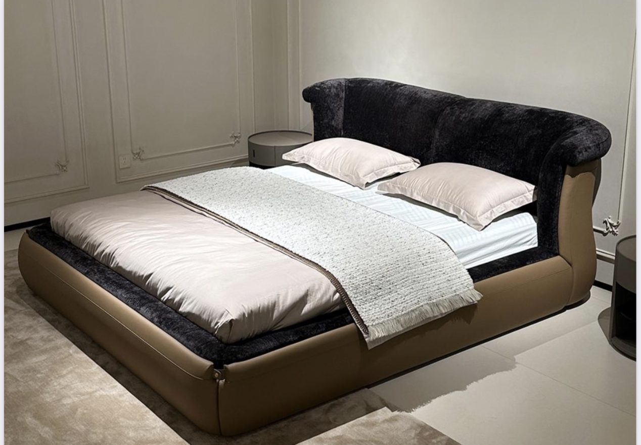 Upholstered bed with a velvet headboard in a showroom