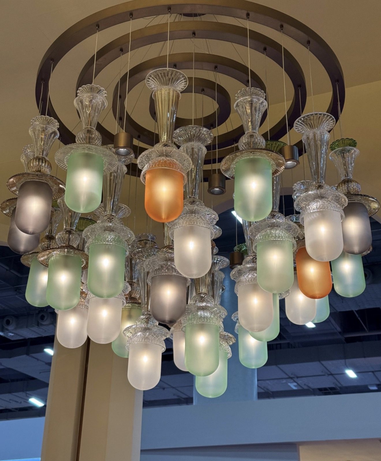 Chandelier of frosted glass shades in a hotel lobby